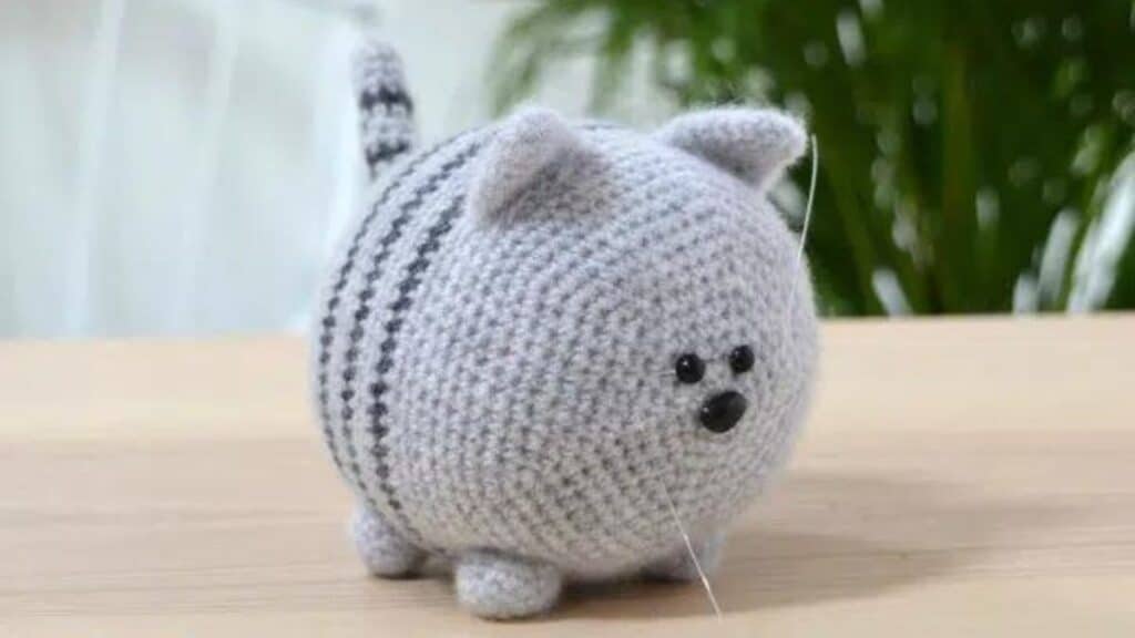 A gray cat with stripes, crocheted.