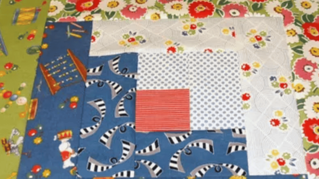 log cabin quilt patterns with blue, peach and white patterned fabric