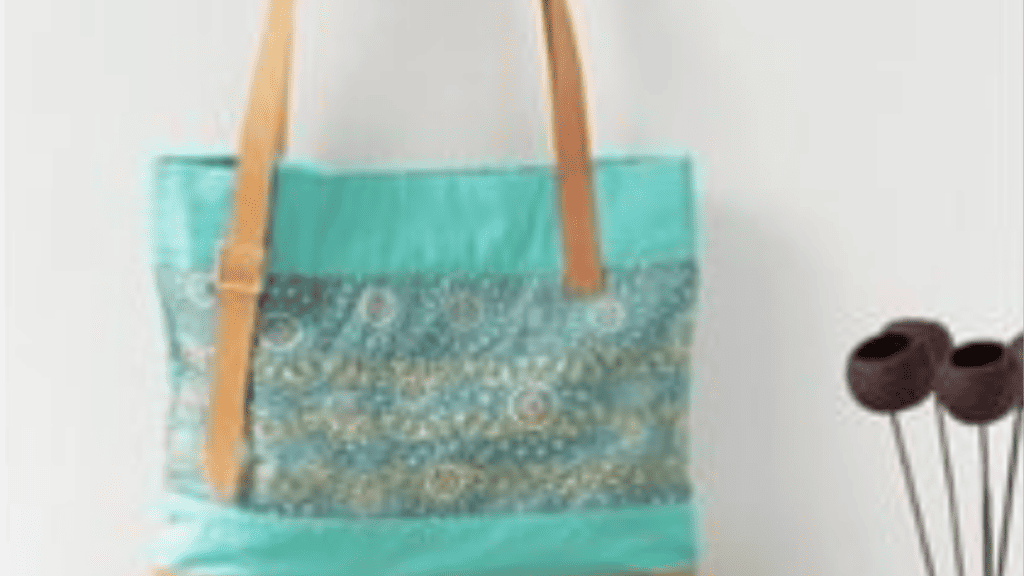 Green tote with a flowered fabric in the middle