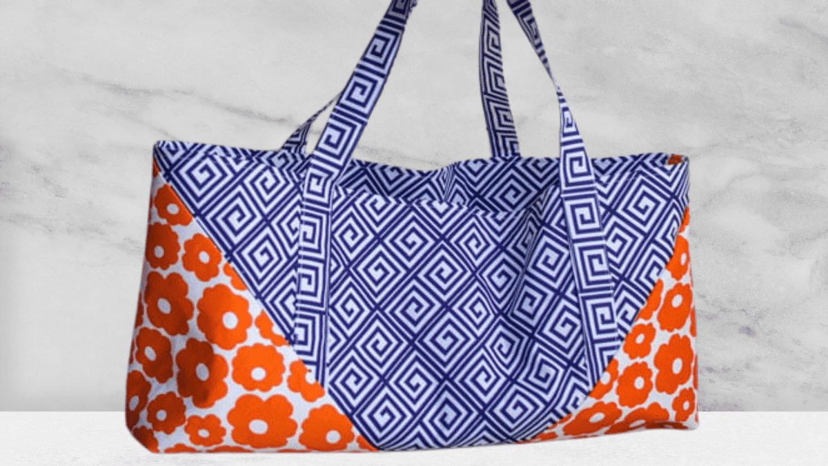 tote bag with flowered fabric on bottom and purple middle fabric