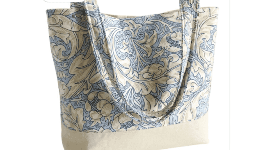 tote bag with blue floral fabric on top and cream bottom