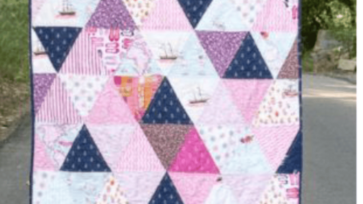 pinks and purple triangle shapes made from a fat quarter quilt pattern