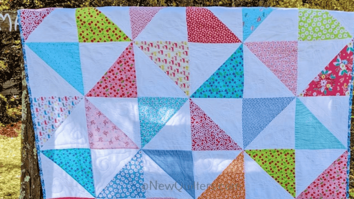 triangles from flowered fabric made into a 10 inch square quilt pattern
