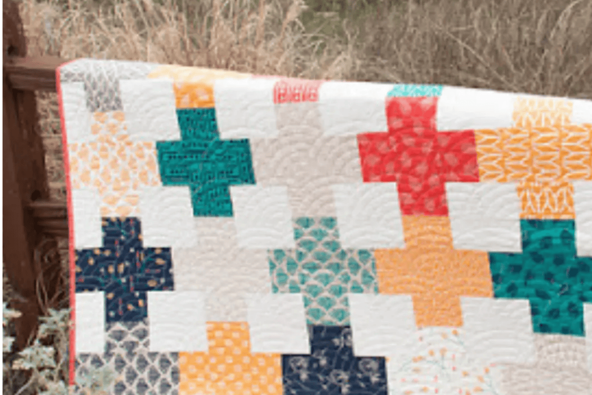 different colored plus signs with white backgroup quilt patterns with squares