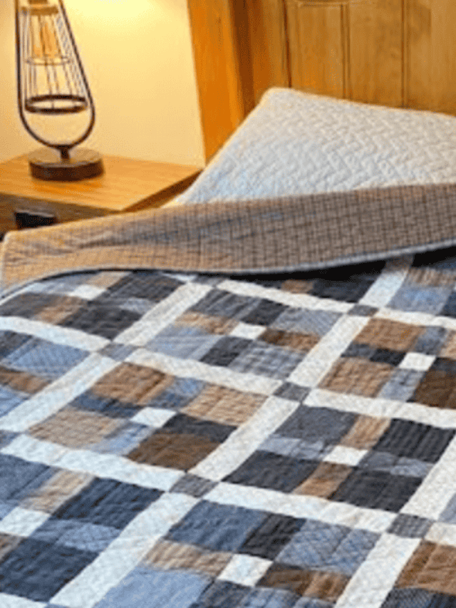 quilt with squares in blues and browns