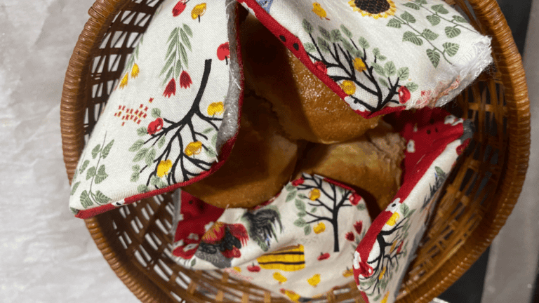 Fabric bread warmer pattern created with white kitchen fabric and red backside