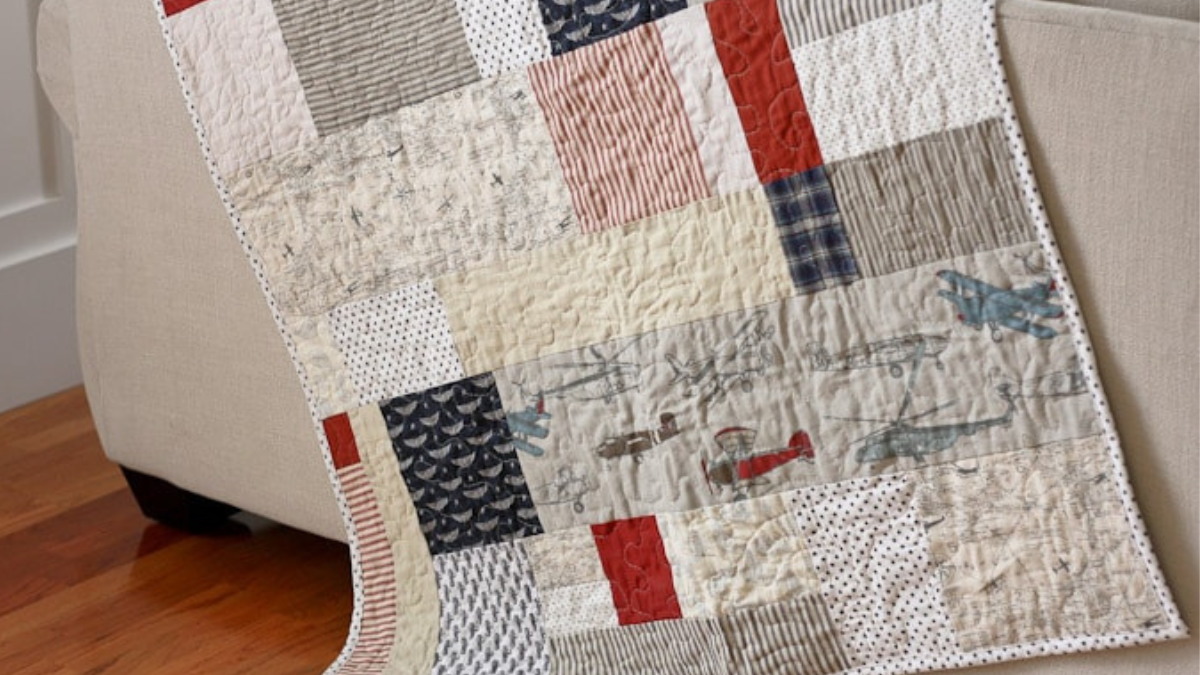 red, gray and brown quilt