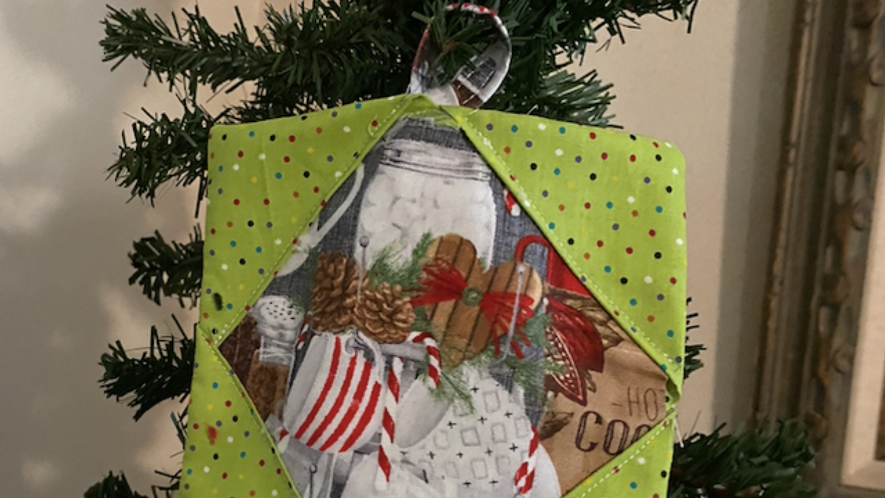 Christmas ornament with green and designed fabric