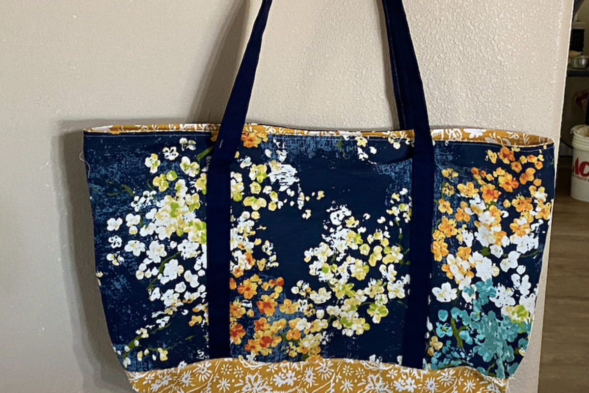 Flowered fabric with yellow bottom lined tote bag