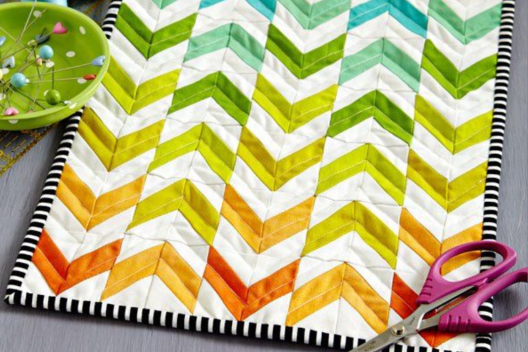 Many quilt with rainbow chevrons